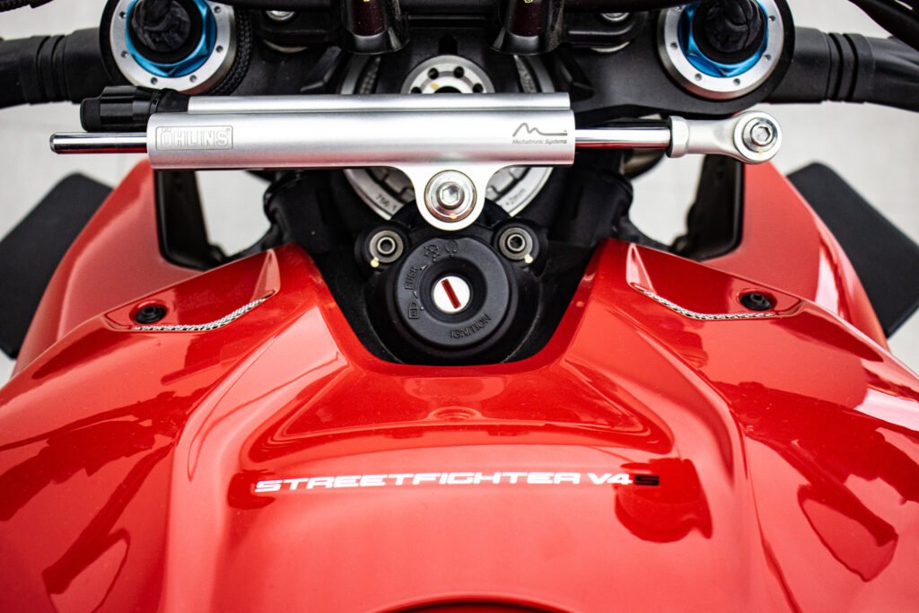 the engine of a red motorcycle